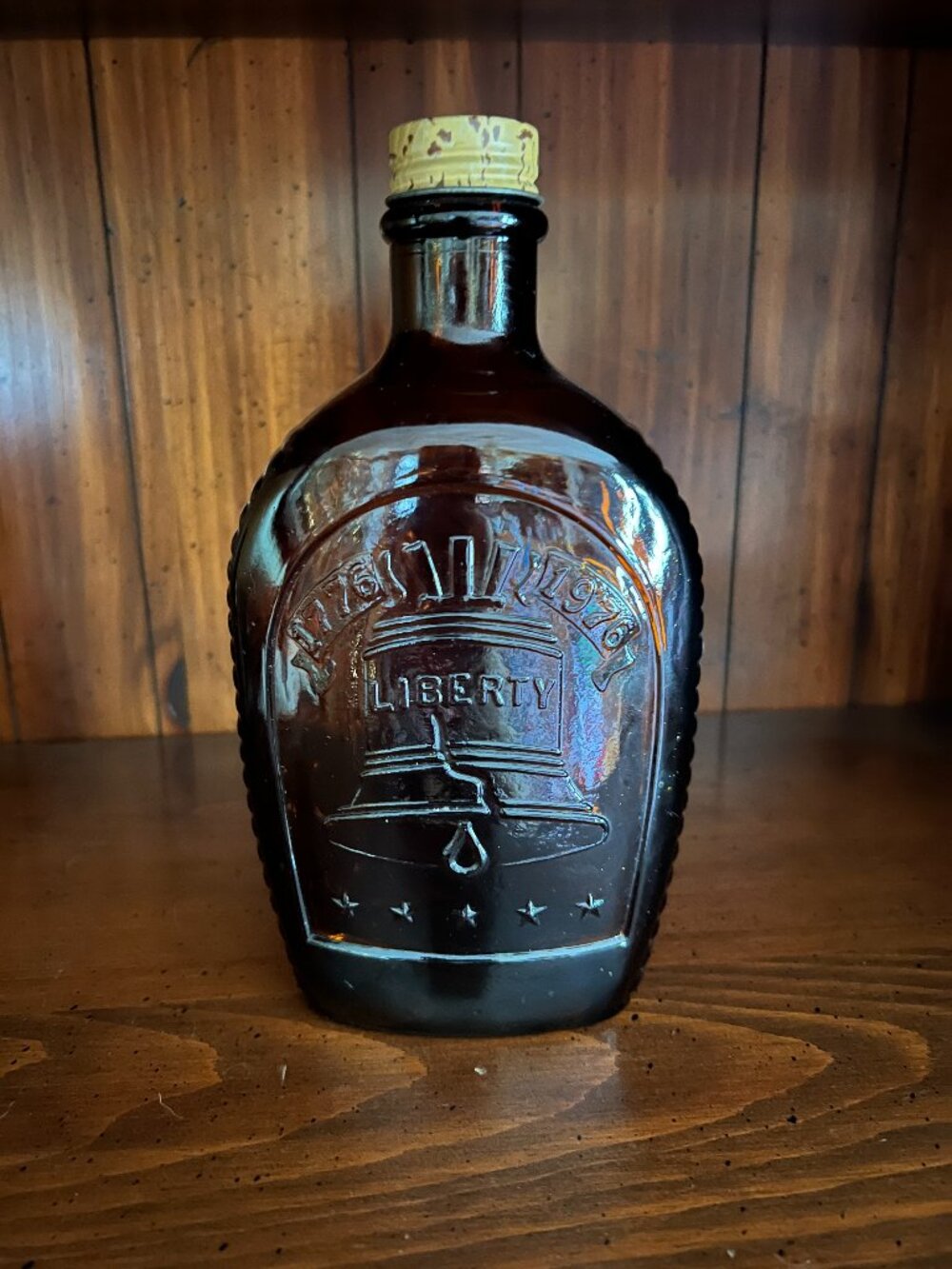 Vintage 1976 Log Cabin Syrup Bicentennial Liberty Bell Amber Bottle